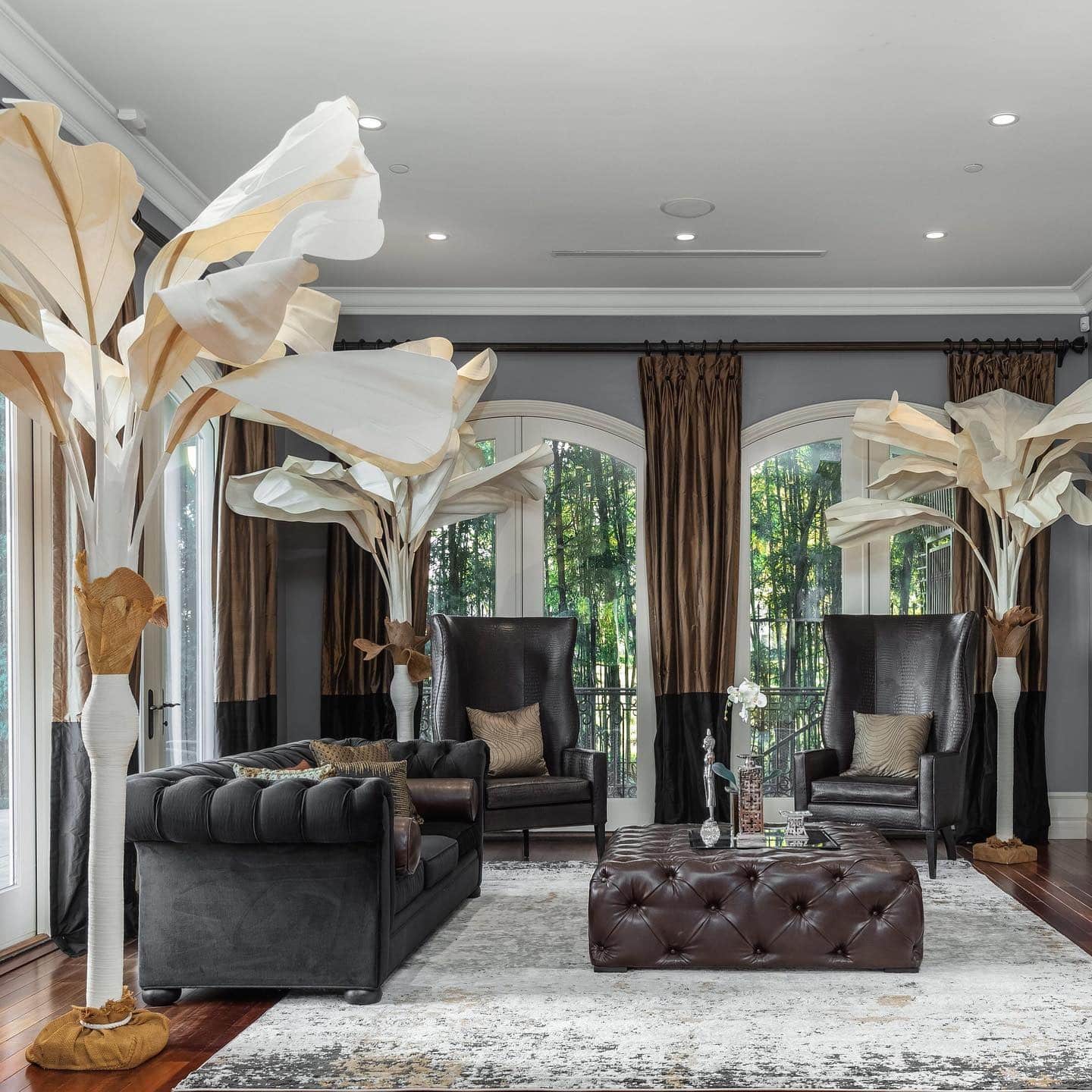 4. Grand Masculine Drama with Sculptural Accents - masculine living room ideas