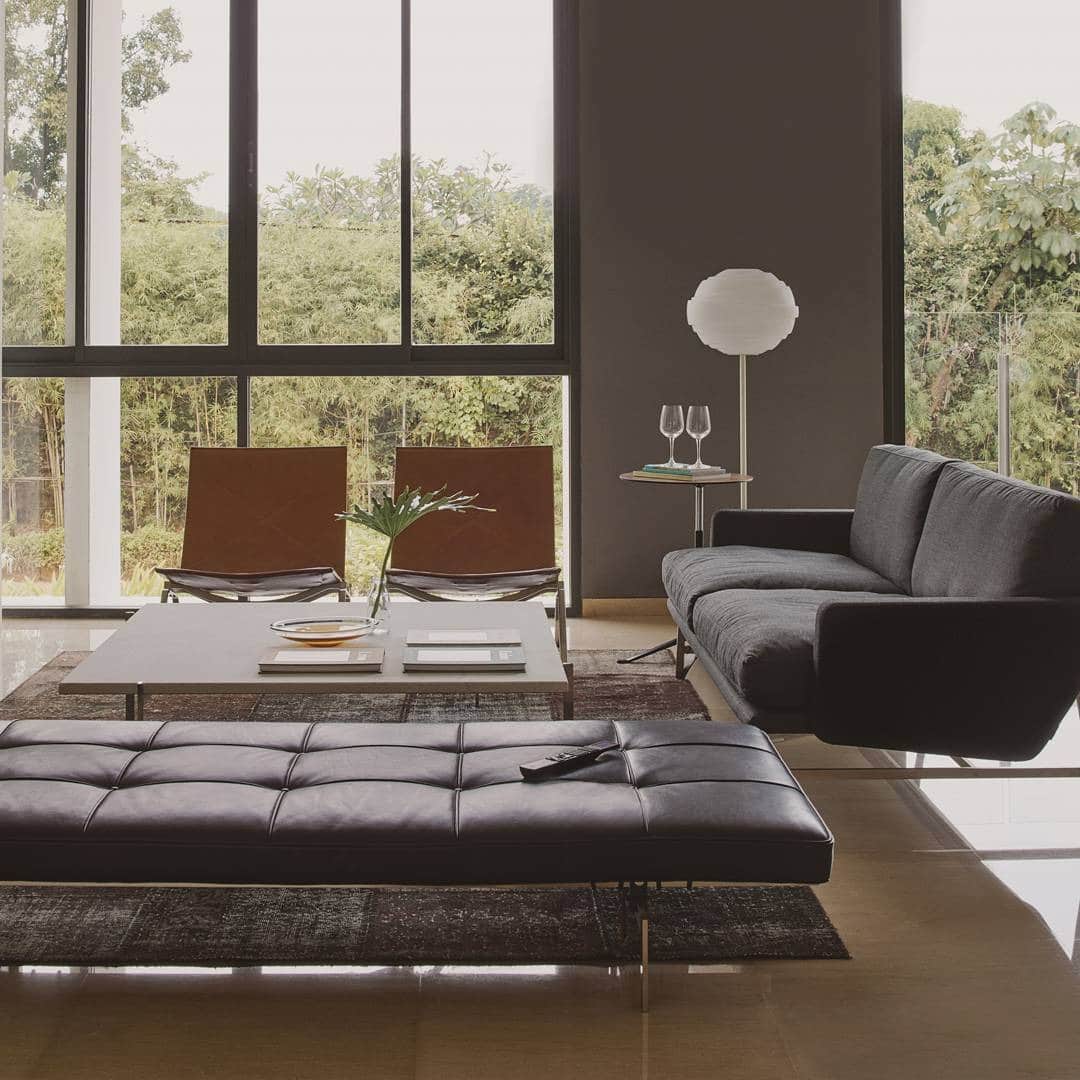 10. Modern Masculine Minimalism with Natural Light - masculine living room ideas