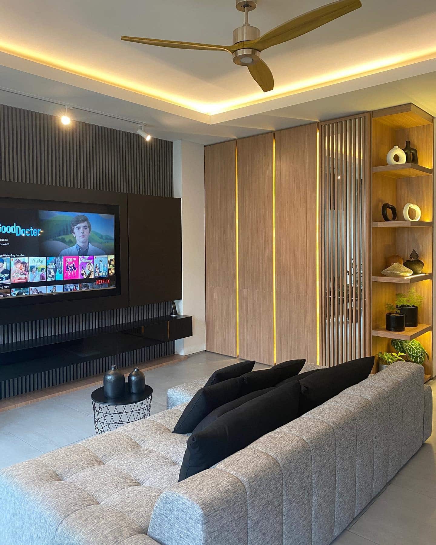 15. Contemporary Edge with Warm Wood and Black Accents - masculine living room ideas