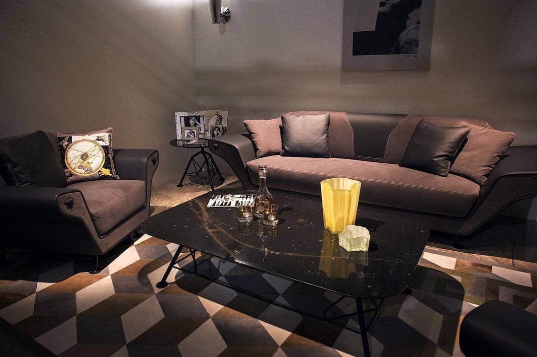 15. Moody Sophistication with Geometric Flair - brown and black living room ideas