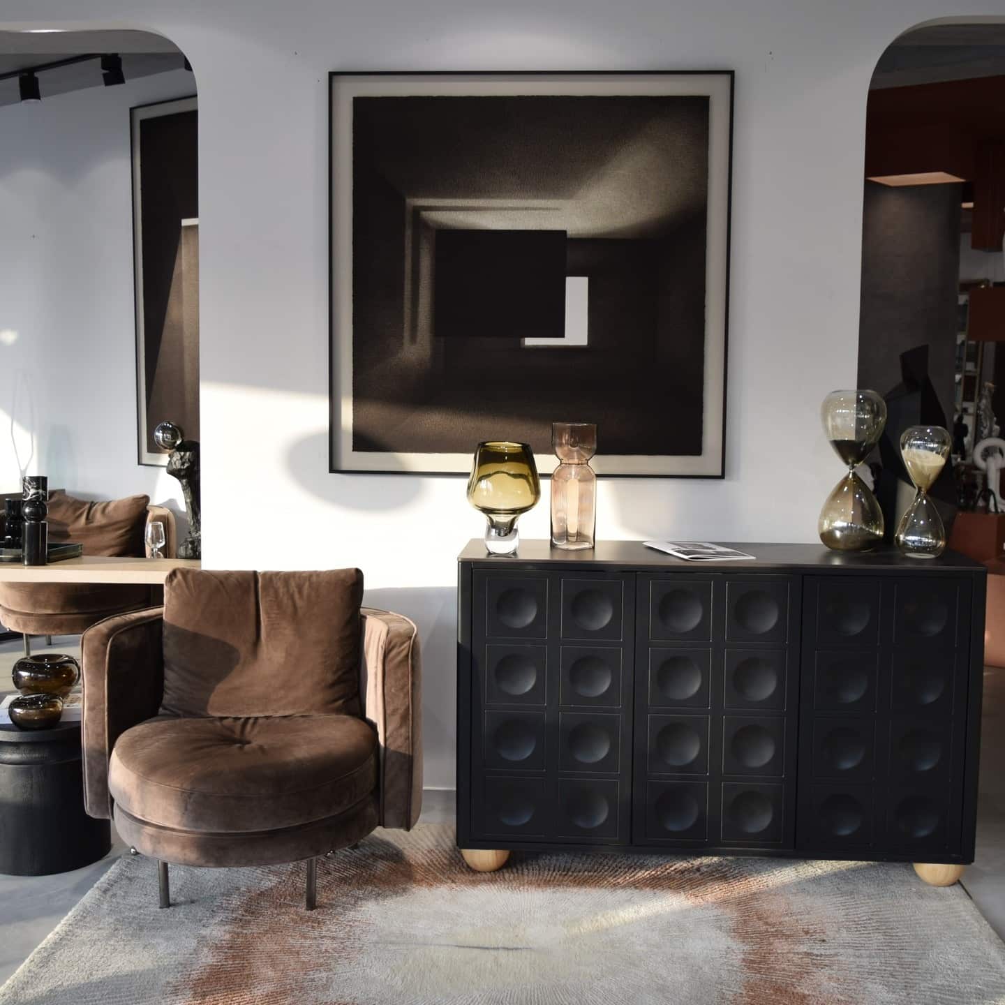 18. Modern Gallery with Sculptural Accents - brown and black living room ideas
