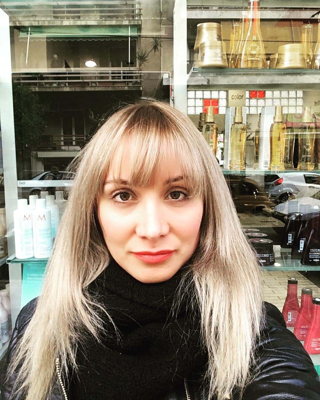 3. Sleek Blonde with Full Fringe - 70S Hairstyles