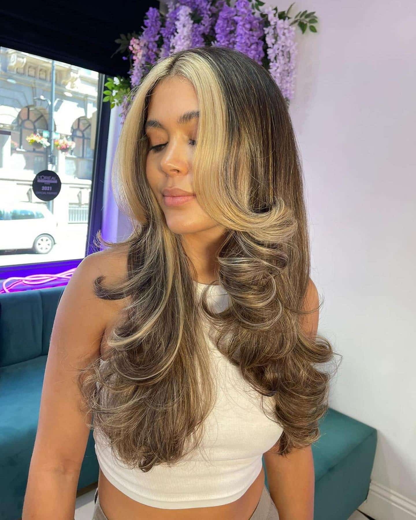 15. Bold Money Piece with Layered Blowout - 70S Hairstyles