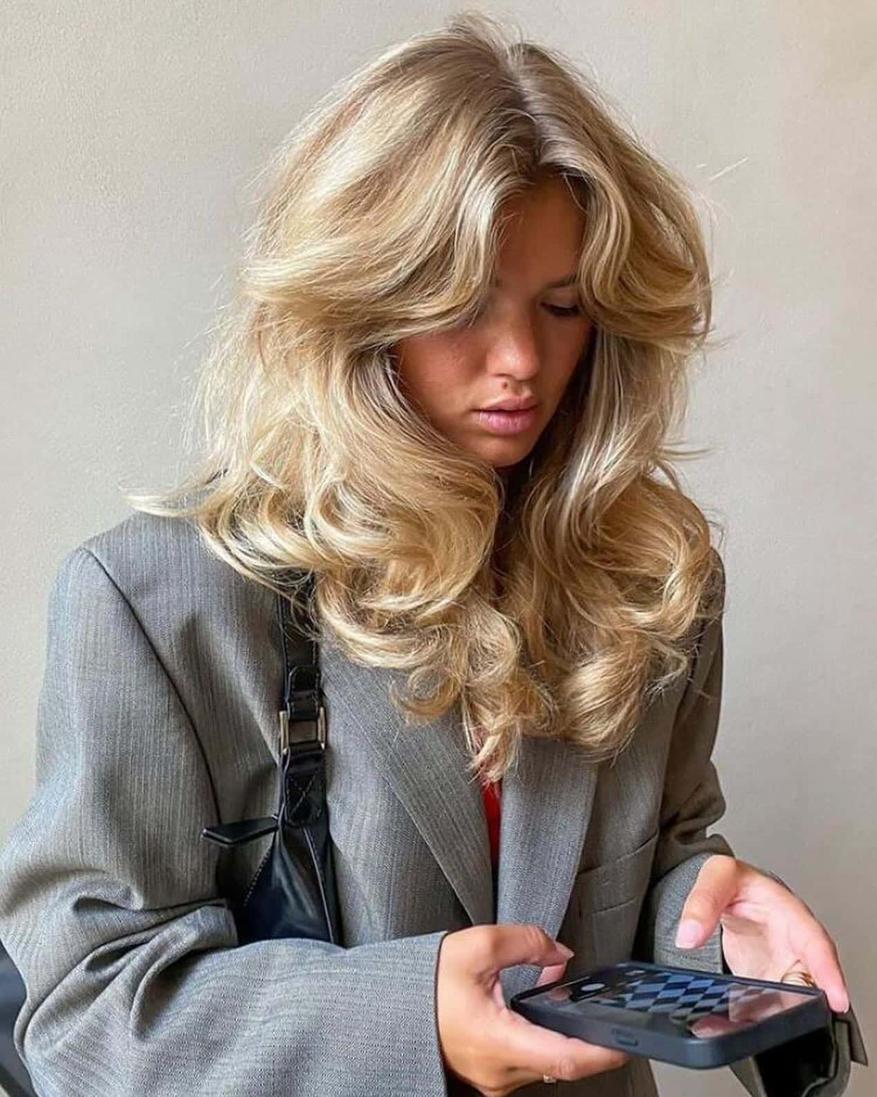 22. Modern Feathered Blowout with Golden Blonde - 70S Hairstyles