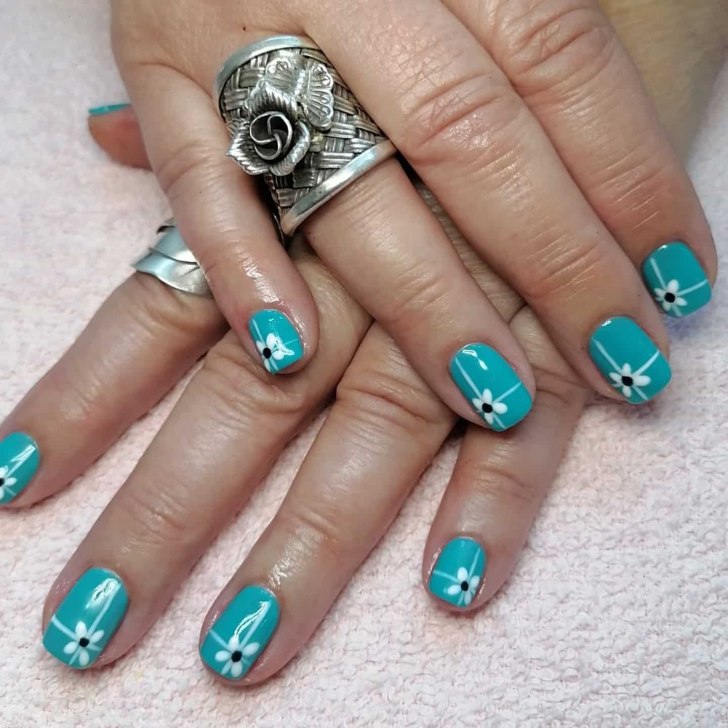 3. Tiffany Blue with Daisy Accents - tiffany blue nail ideas