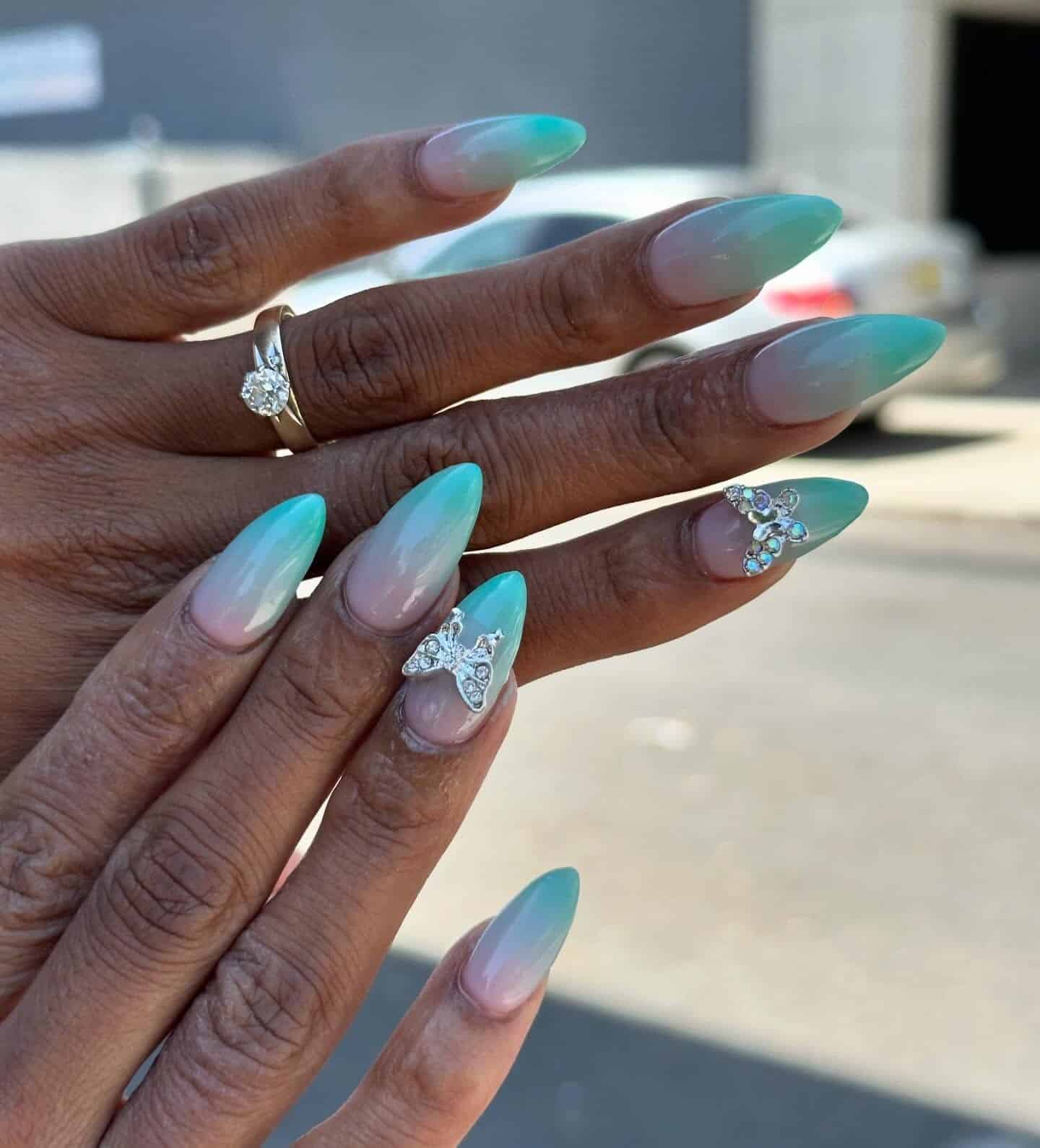 21. Tiffany Blue Ombre with Butterfly Charms - tiffany blue nail ideas