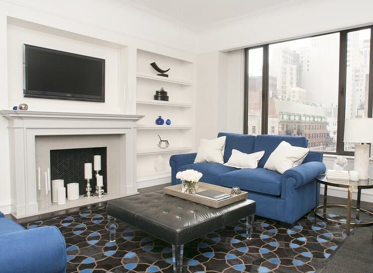 1. Classic Blue Elegance with Modern Contrast - black and blue living room ideas