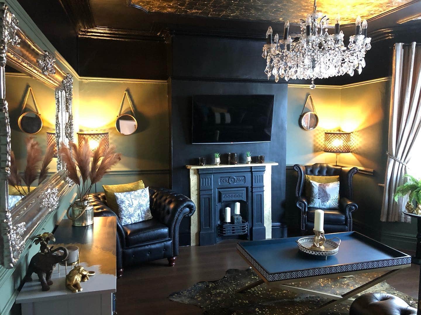 10. Luxe Glamour in Black and Gold - black and blue living room ideas