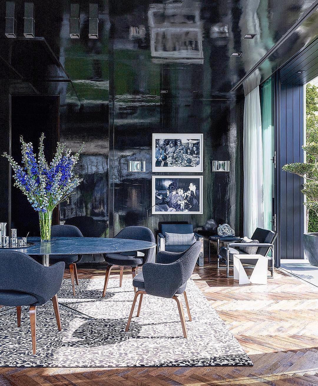 14. Glossy Black Glamour with Blue Seating - black and blue living room ideas