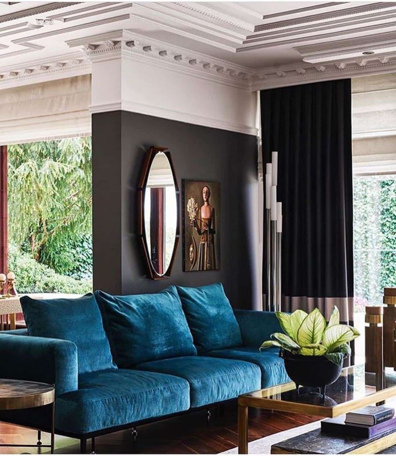 19. Moody Contrast with Teal and Black - black and blue living room ideas