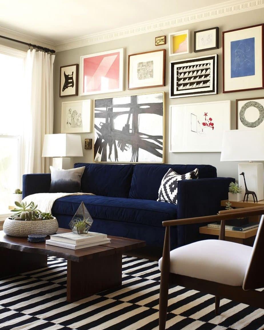 20. Artistic Modern with Blue Sofa and Gallery Wall - black and blue living room ideas