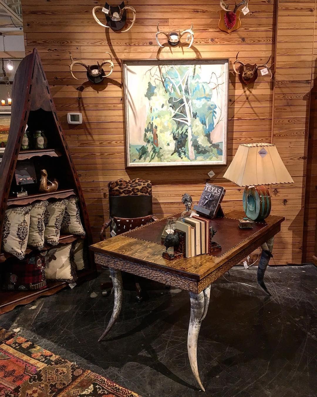 6. Rustic Western Statement with Natural Horn Accents - rustic office ideas