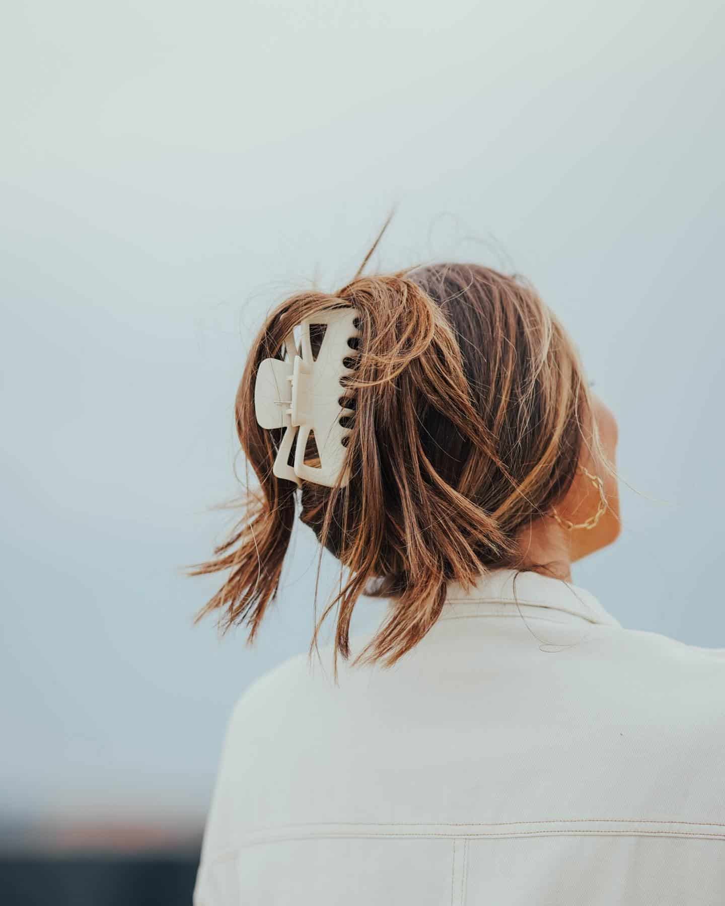 1. Textured Ponytail with Neutral Clip on Brunette Highlights - Claw Clip Hairstyles