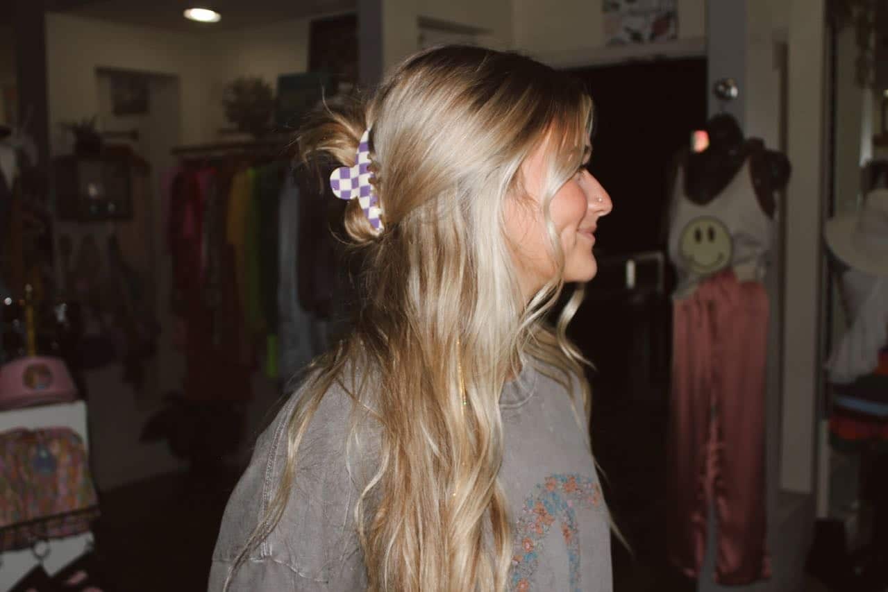 16. Loose Half-Up Bun with Checkered Clip on Sandy Blonde Hair - Claw Clip Hairstyles