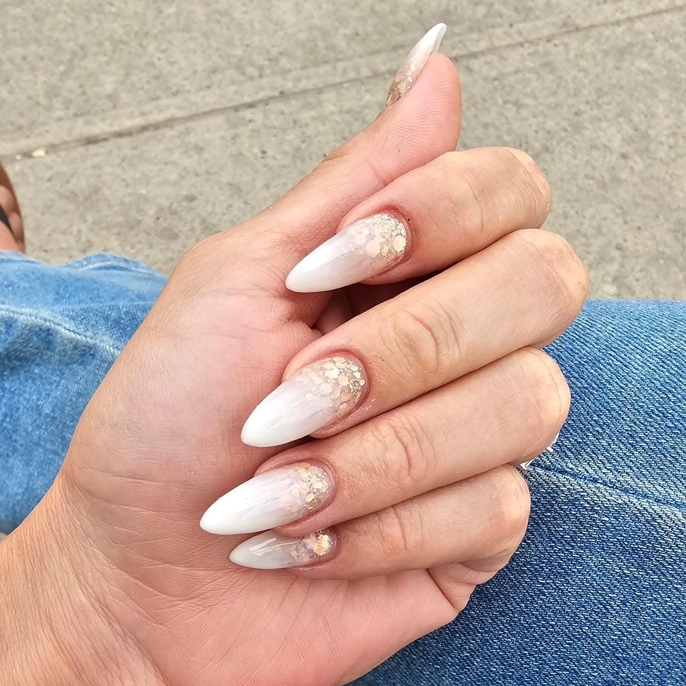 10. Gold Glitter Ombre Stilettos - white ombre nail ideas