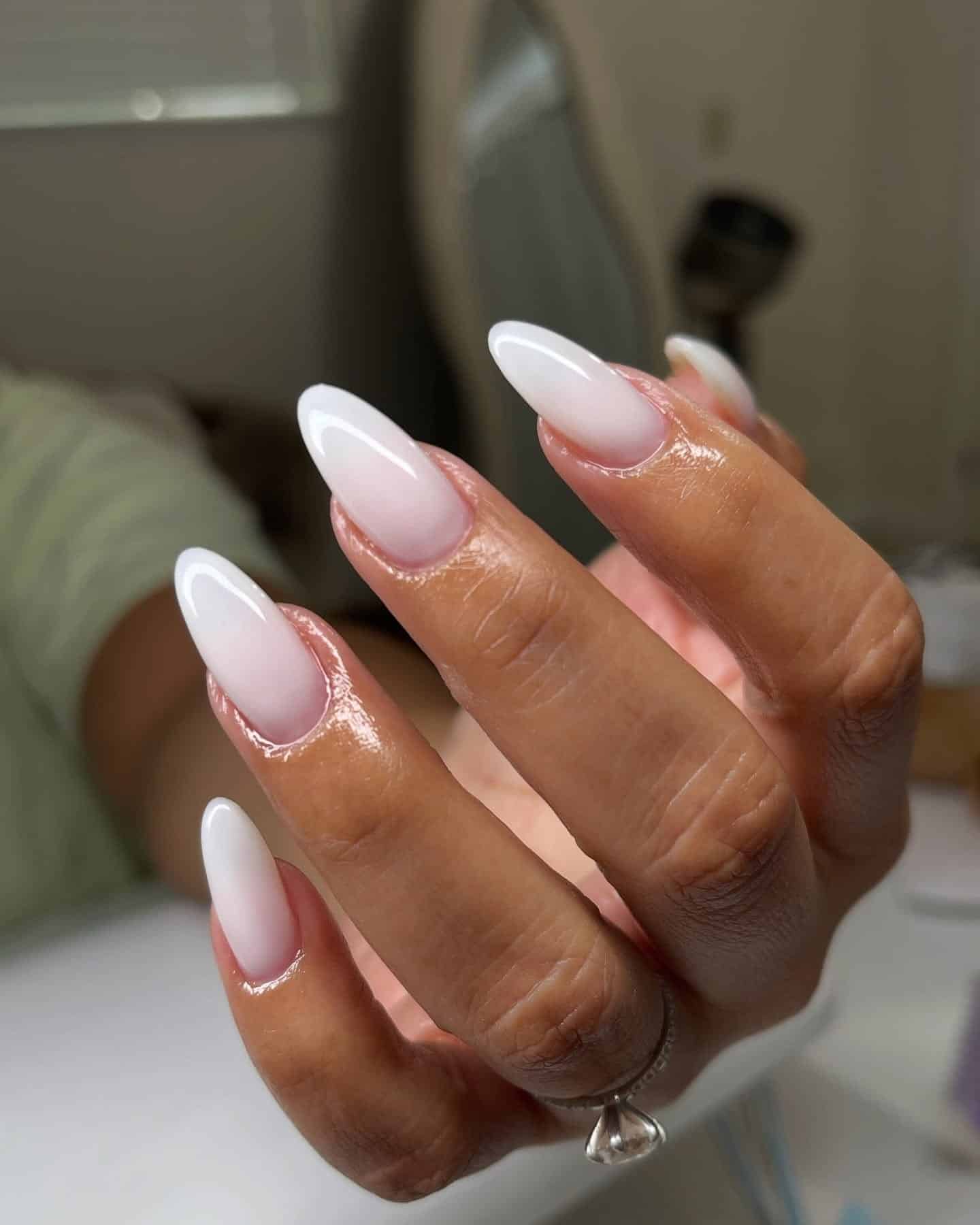 19. Glossy Almond Ombre Perfection - white ombre nail ideas