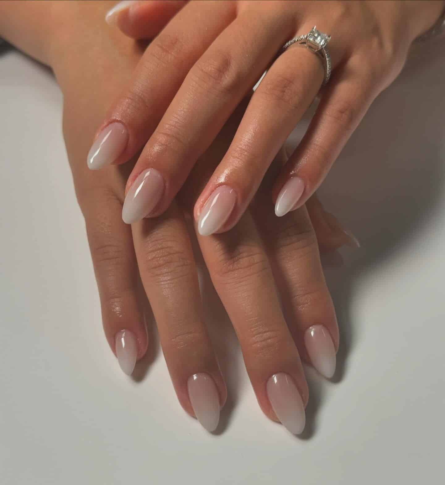 22. Soft Fade Almond Ombre - white ombre nail ideas