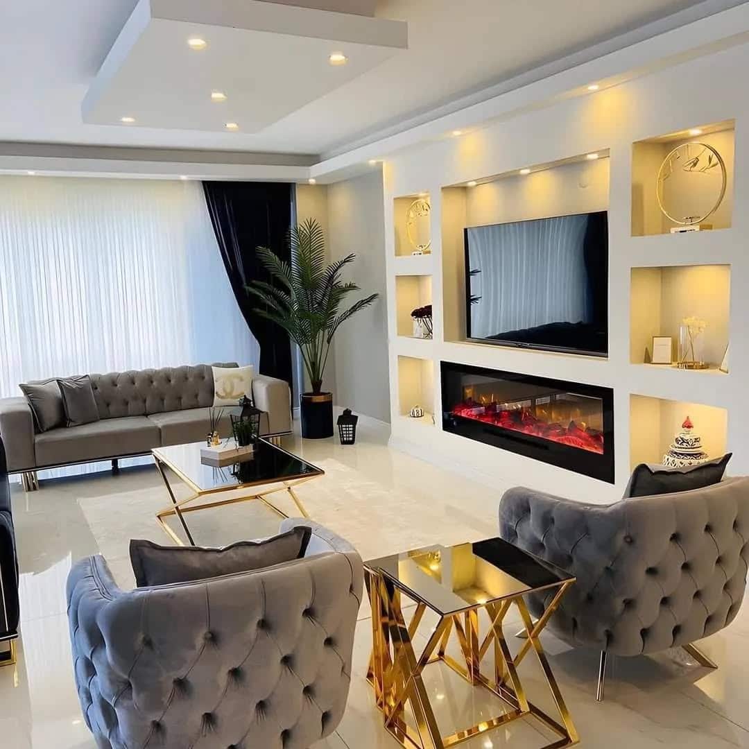 1. Contemporary Elegance with Golden Accents - living room tv ideas