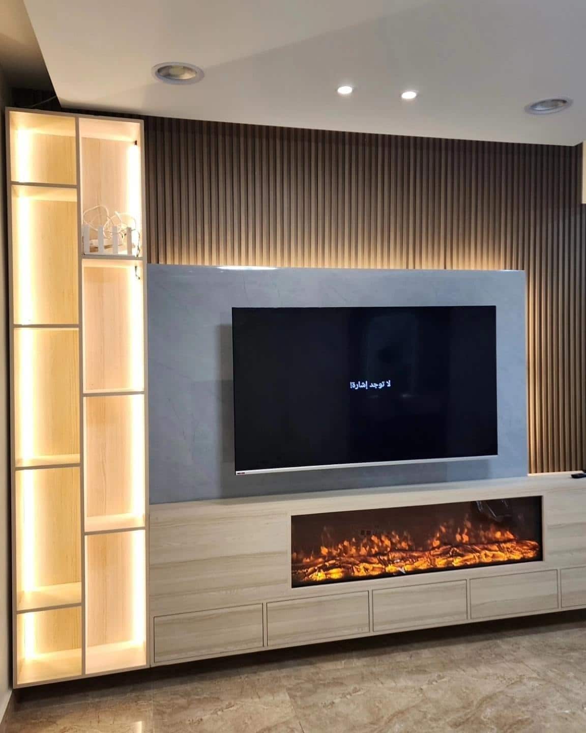 12. Contemporary Warmth with Built-In Fireplace - living room tv ideas