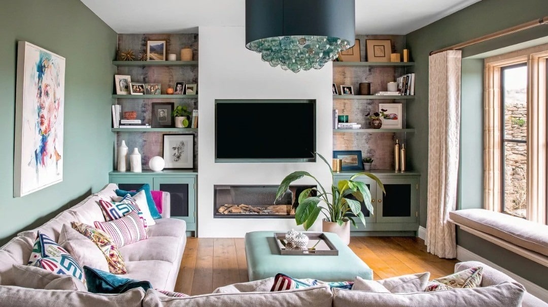 21. Sage Green Comfort with Built-In Shelving - living room tv ideas
