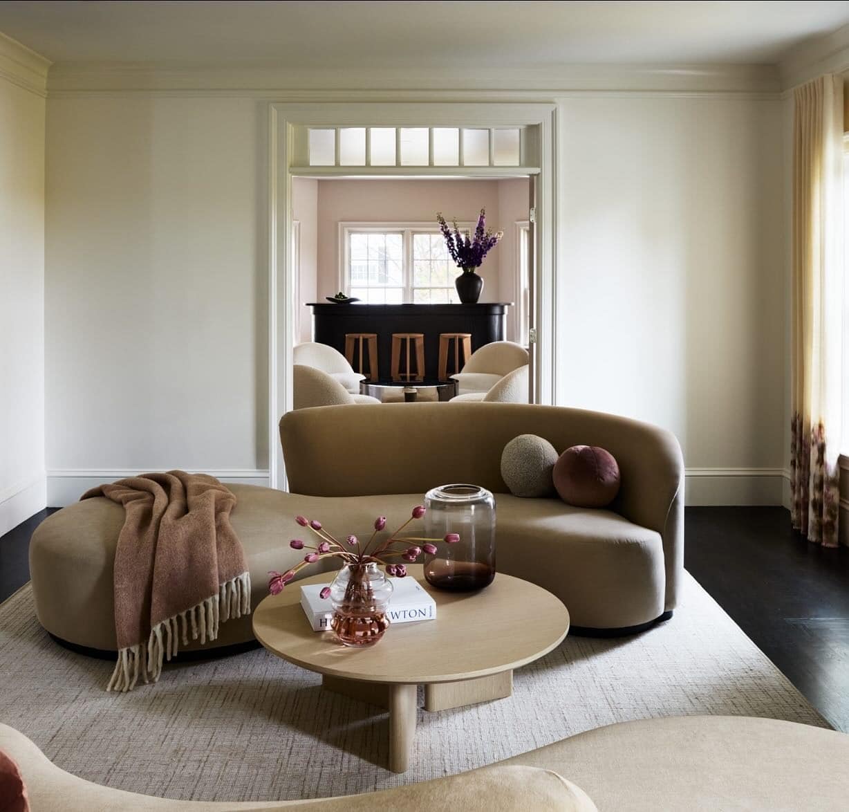 15. Sculptural Curves in Soft Beige - lounge office room ideas