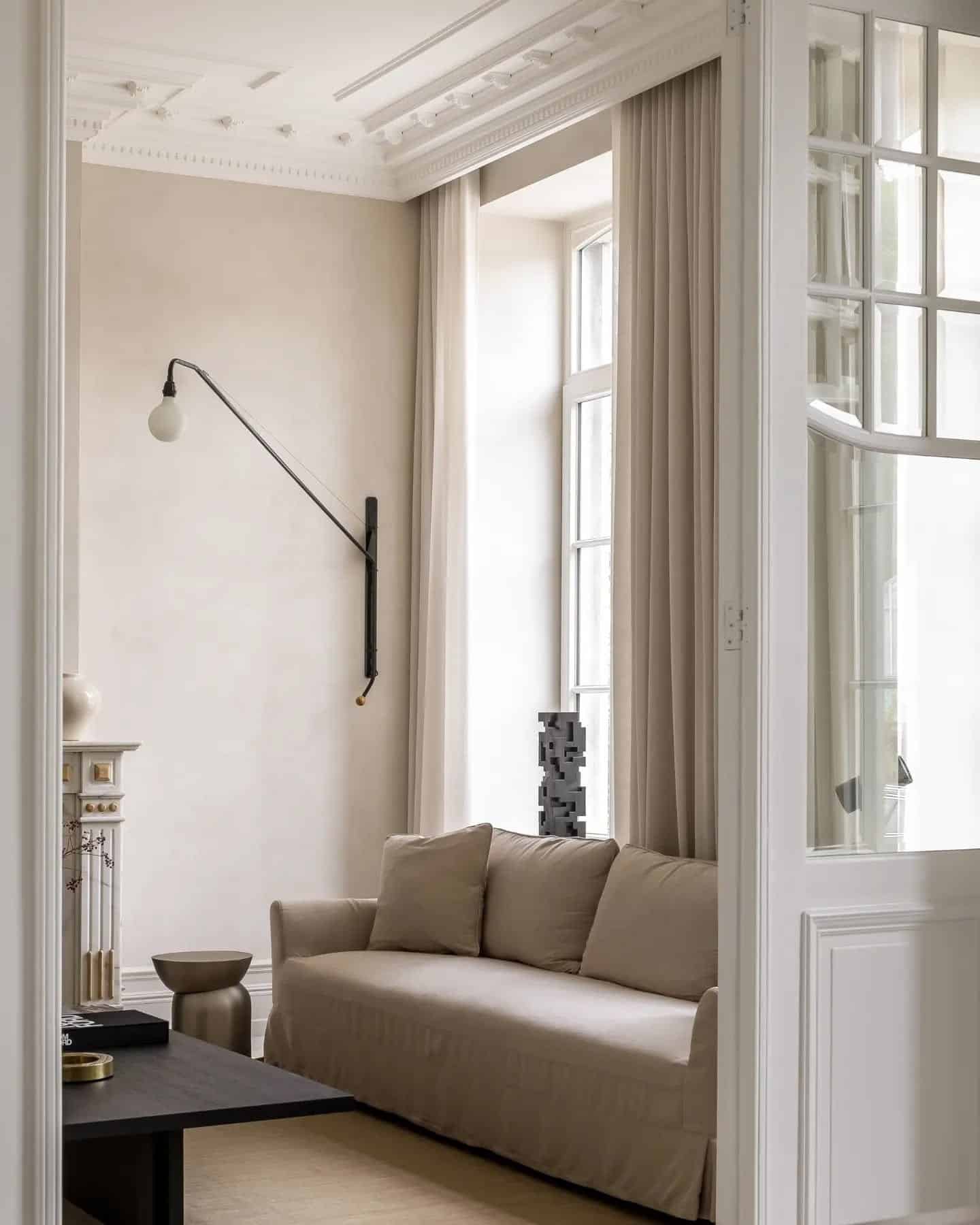 19. Neutral Elegance with Architectural Detailing - lounge office room ideas