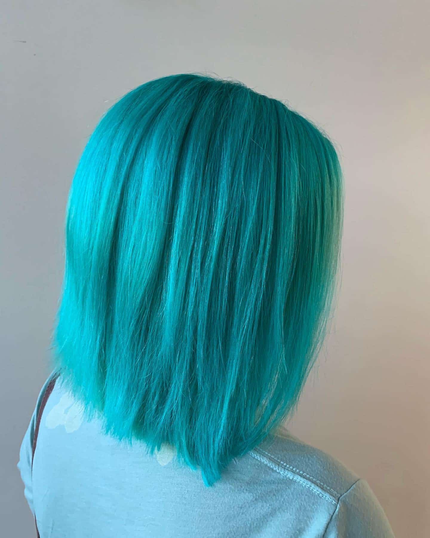 4. Sleek Aqua Mid-Length - Teal Hair Color