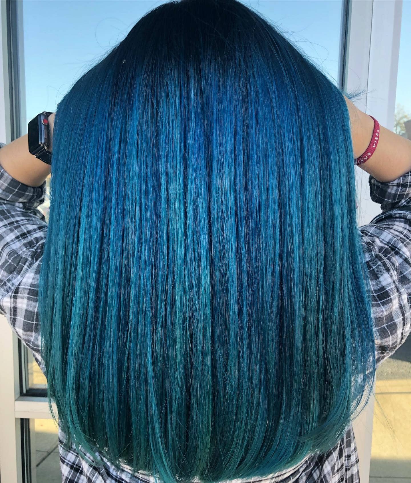 14. Ocean-Inspired Straight Layers - Teal Hair Color