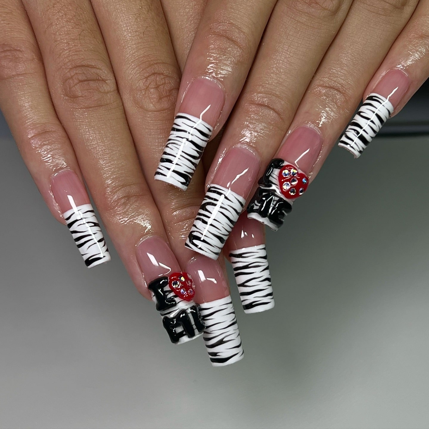 2. Monochrome Zebra Coffin Nails with 3D Accents - zebra nail ideas