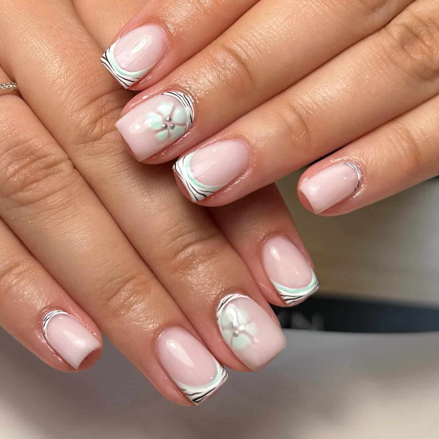 6. Soft Pink Zebra French with Floral Accent - zebra nail ideas