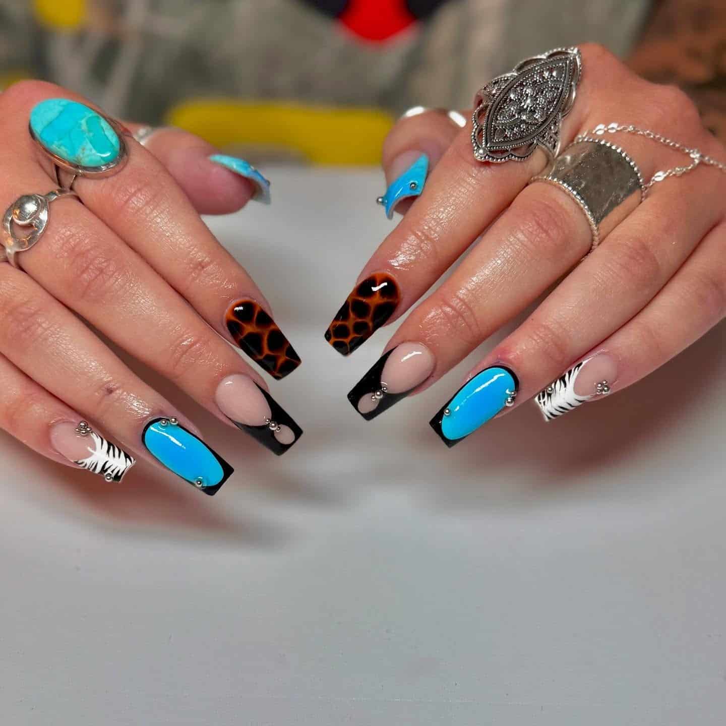 7. Mixed Animal Print with Zebra, Leopard, and Bold Blue - zebra nail ideas