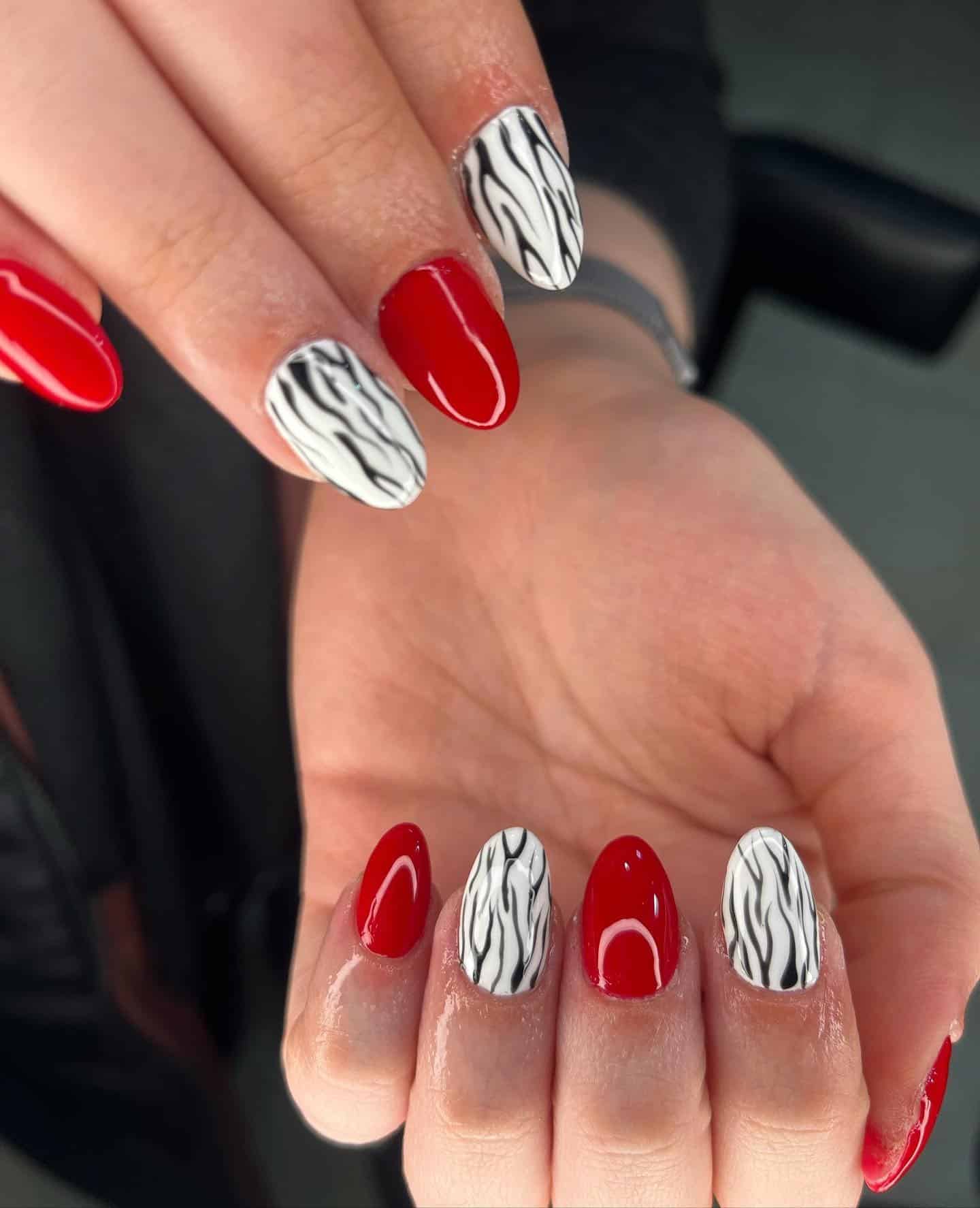 10. Red and White Zebra Almond Nails - zebra nail ideas