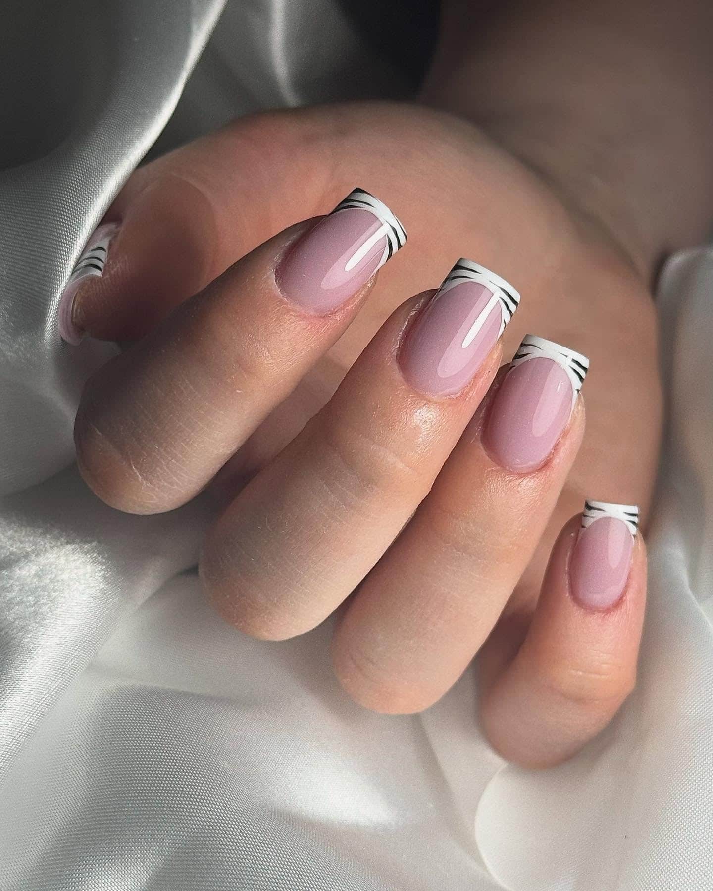 16. Subtle Zebra French on Pink Base - zebra nail ideas