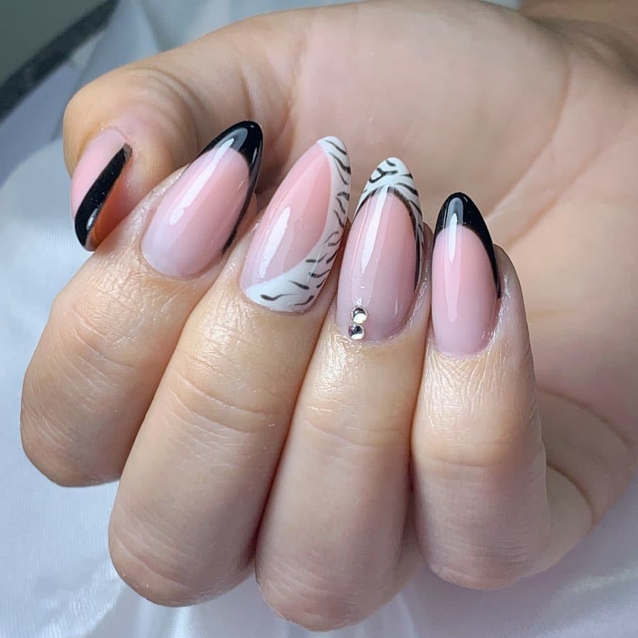 17. Black and Zebra French with Rhinestones - zebra nail ideas