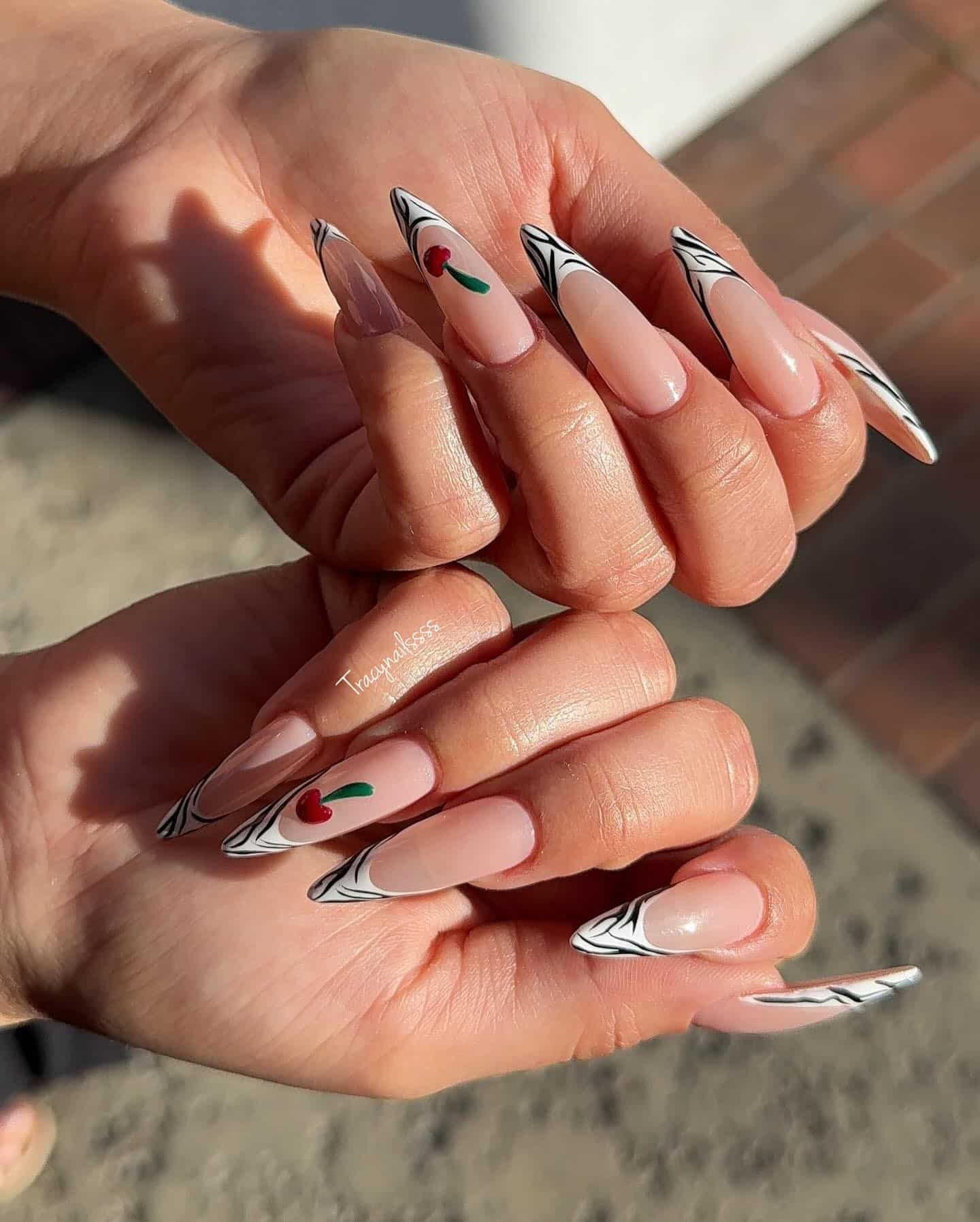 18. Long Zebra French with Cherry Detail - zebra nail ideas