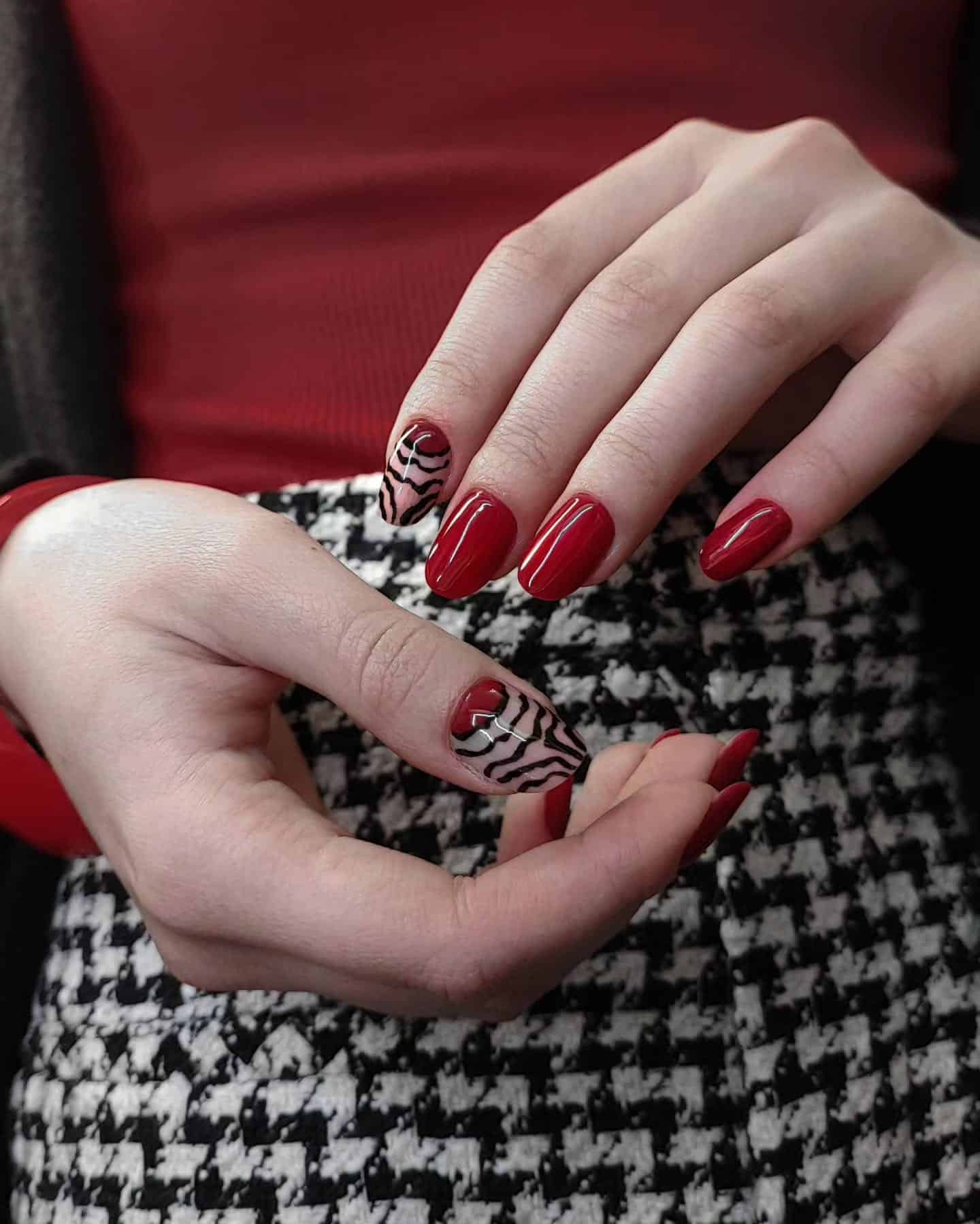 20. Classic Red with Zebra Accent - zebra nail ideas