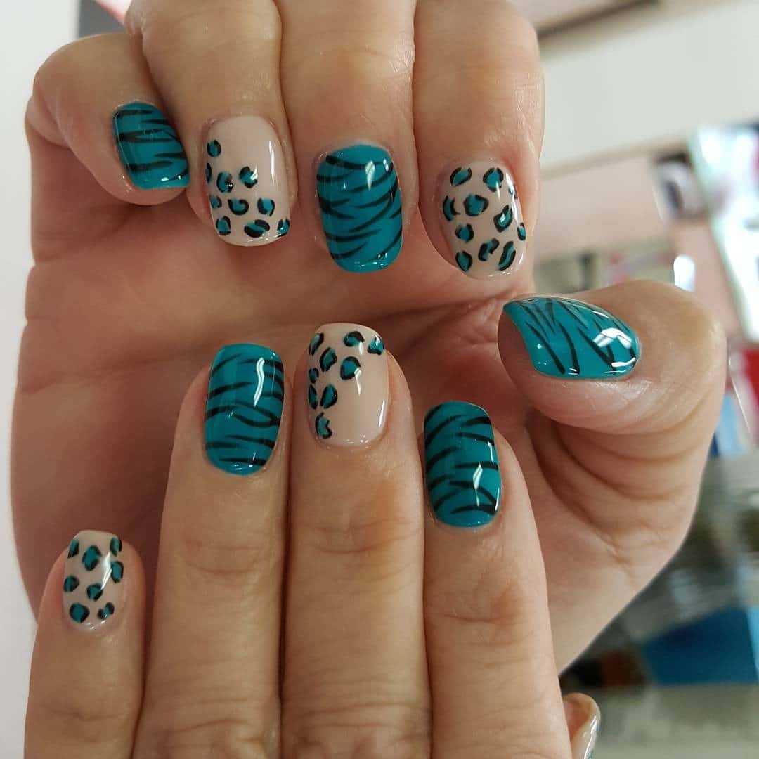 21. Teal Zebra and Leopard Mix - zebra nail ideas