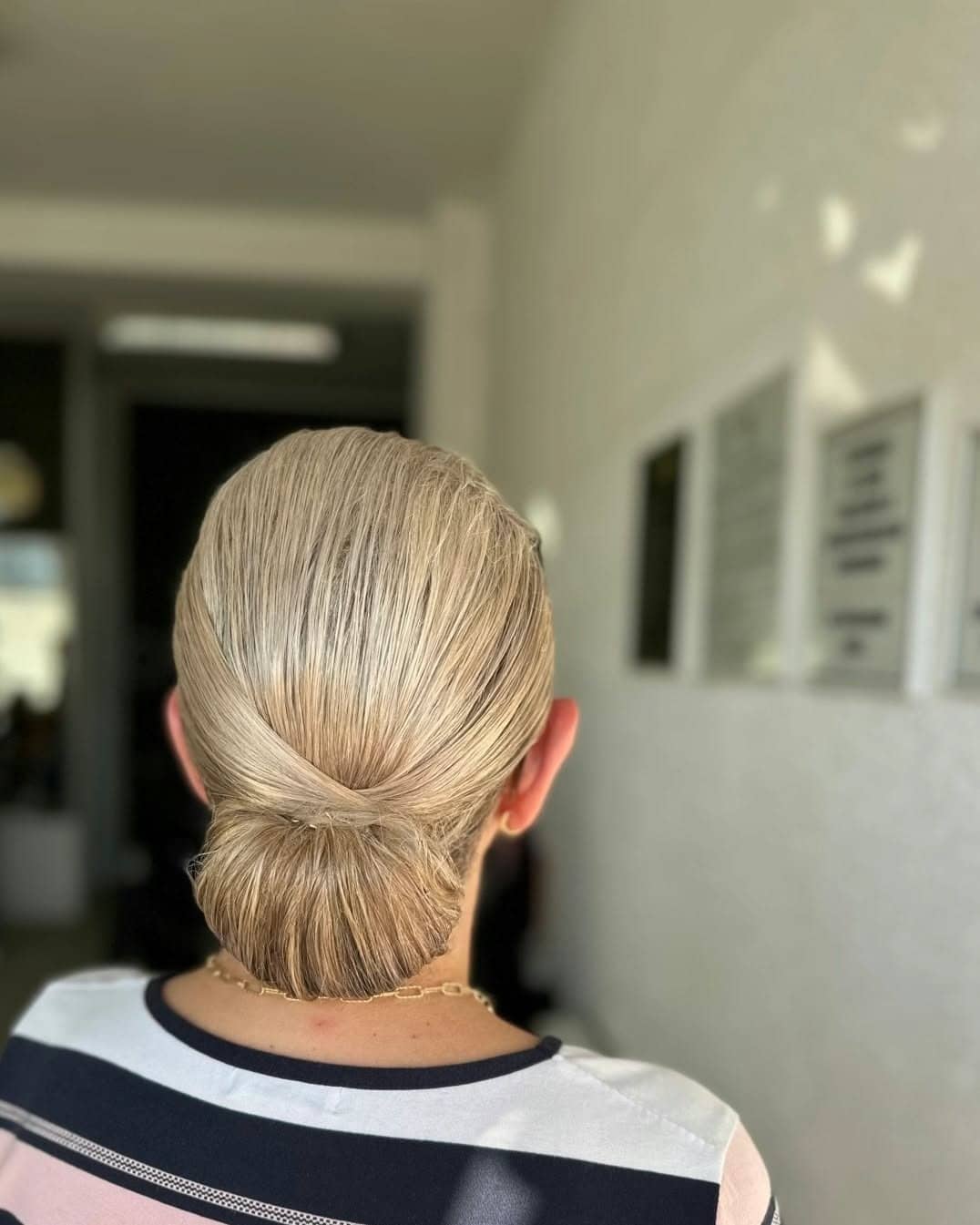 1. Sleek Low Bun Elegance on Platinum Blonde - Formal Hairstyles