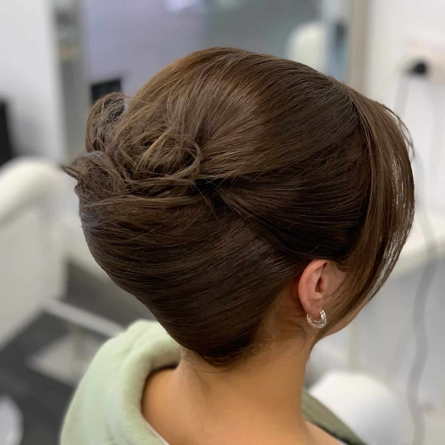 14. French Roll Elegance on Espresso Brown - Formal Hairstyles