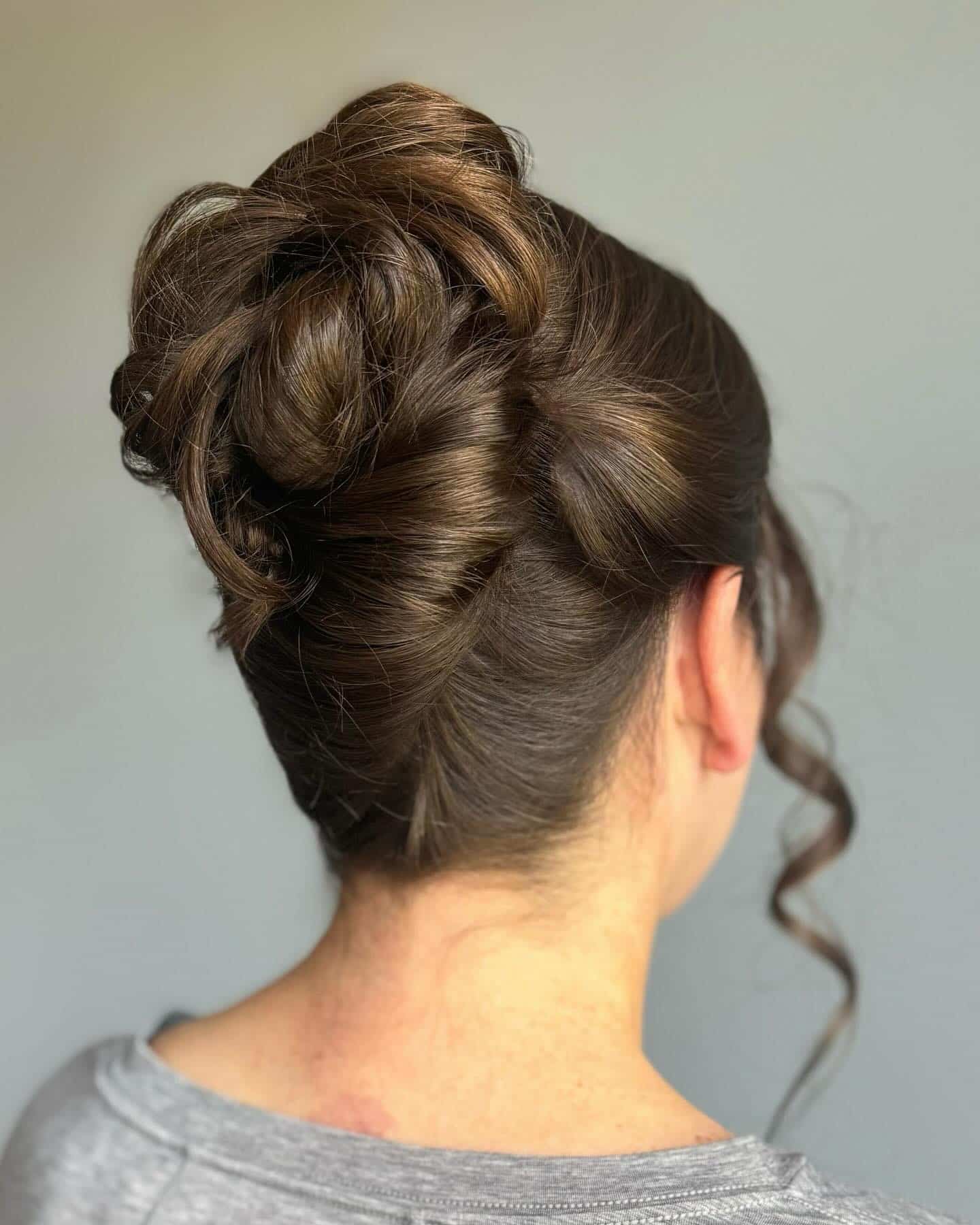 20. Structured French Twist with Volume on Rich Brunette - Formal Hairstyles