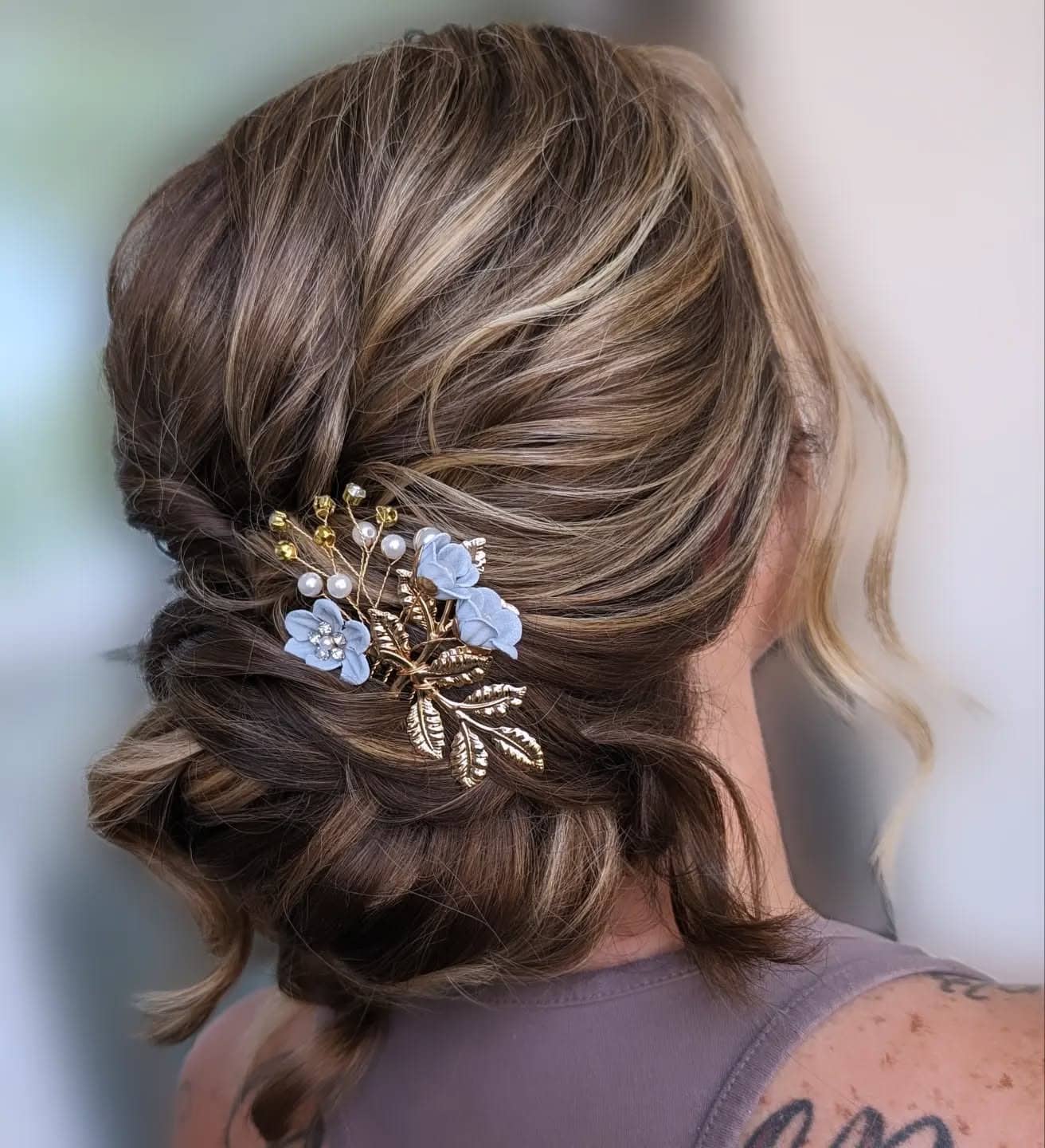 21. Textured Low Updo with Floral and Pearl Accent on Ash Brown - Formal Hairstyles