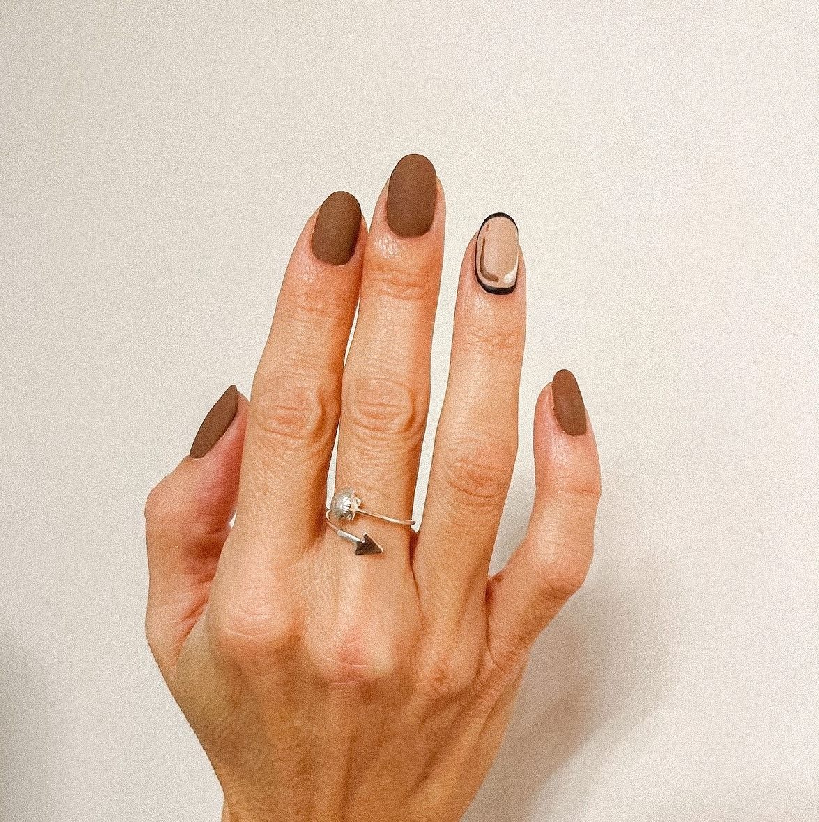 1. Matte Mocha with Modern Accent - accent nail ideas