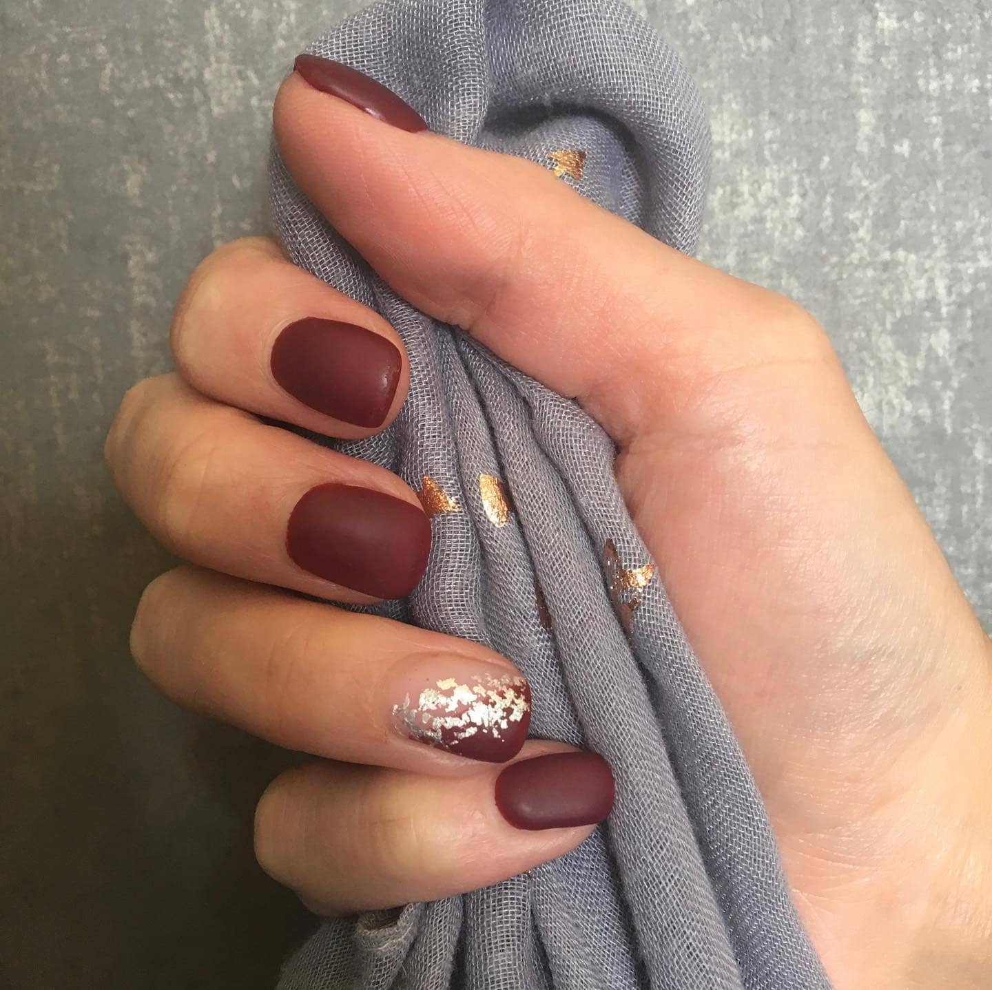 9. Matte Burgundy with Foil Accent - accent nail ideas