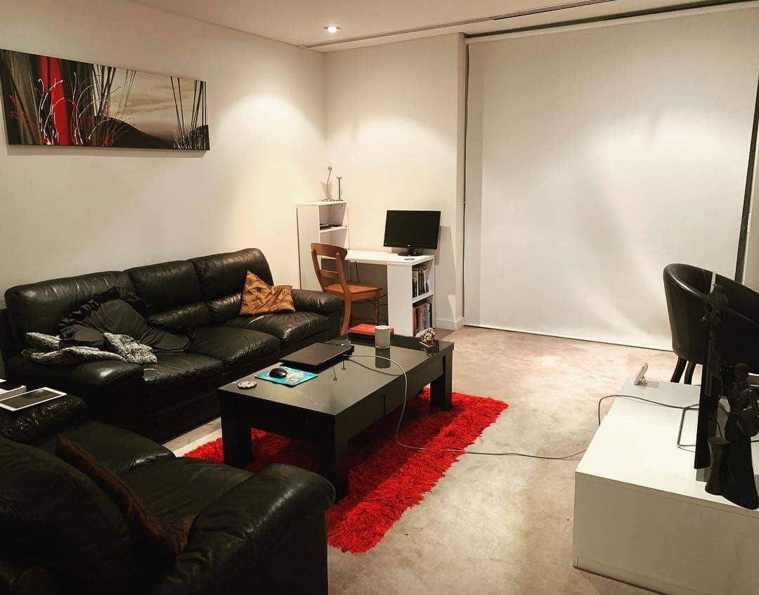 2. Sleek Modern Comfort - red and black living room ideas