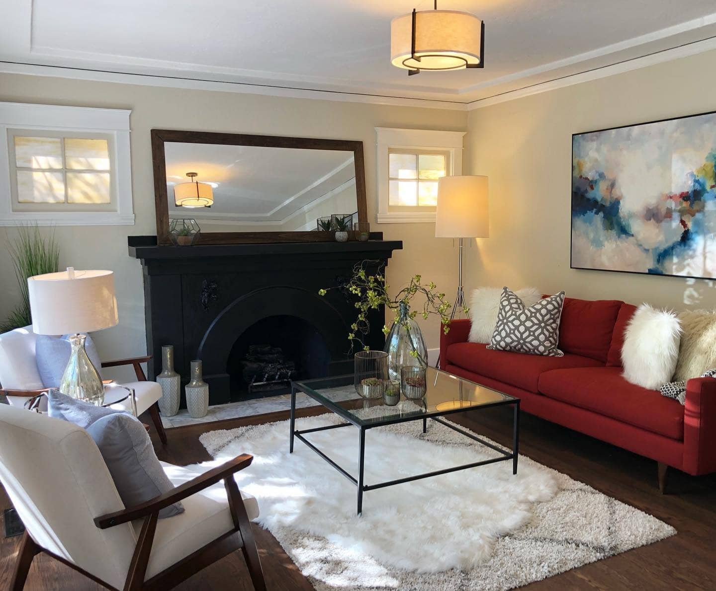 7. Warm and Welcoming - red and black living room ideas