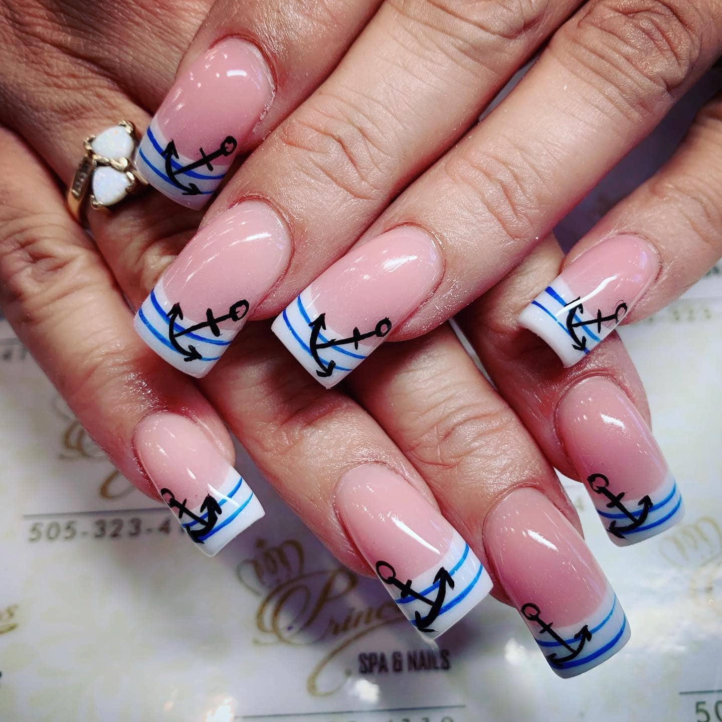 4. French Tips with Nautical Anchors - anchor nail ideas