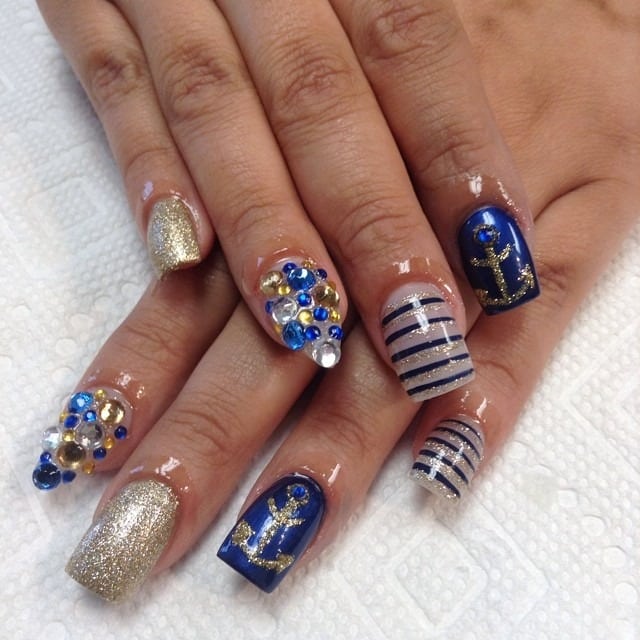 14. Glamorous Gold and Anchor Embellishments - anchor nail ideas