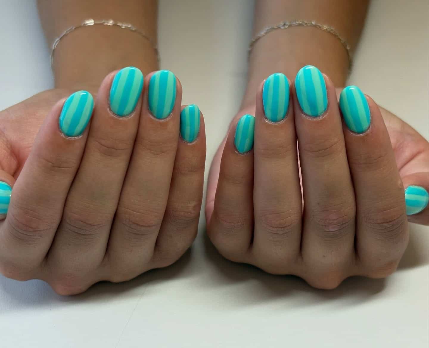 21. Aqua Stripe Elegance - aqua color nail ideas