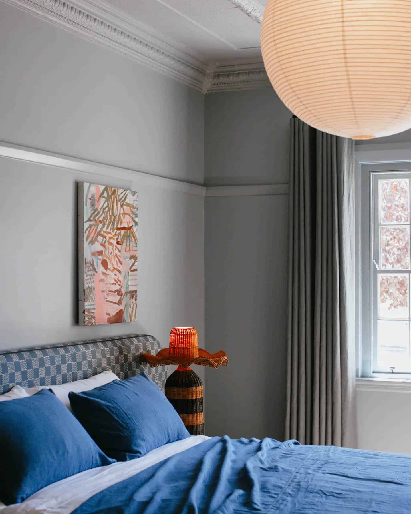20. Fresh Contrast with Statement Lighting - blue and gray bedroom ideas
