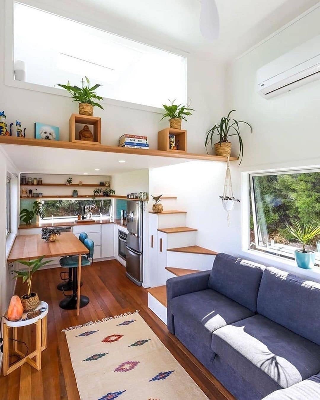 1. Airy White Living with Warm Wood Accents - tiny house living room ideas